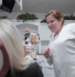 Close-up view of a dental procedure being performed under clinical lighting.