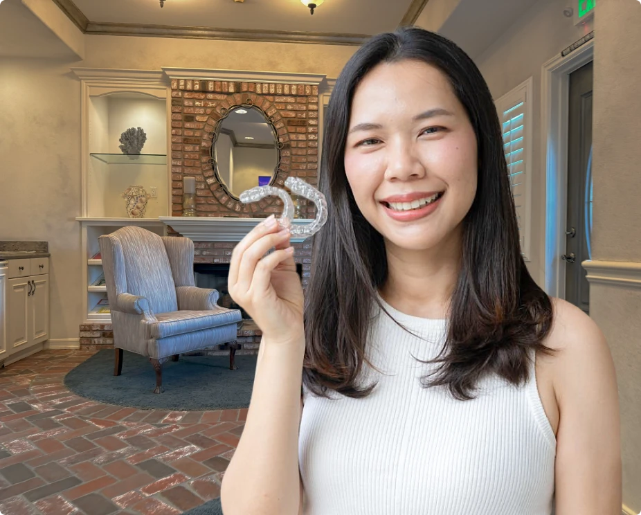 Smiling patient enjoying the benefits of a bruxism mouth guard.