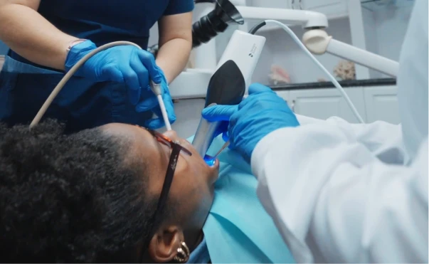 Professional dental cleaning tools and process with real patient representing preventive dentistry in San Diego.