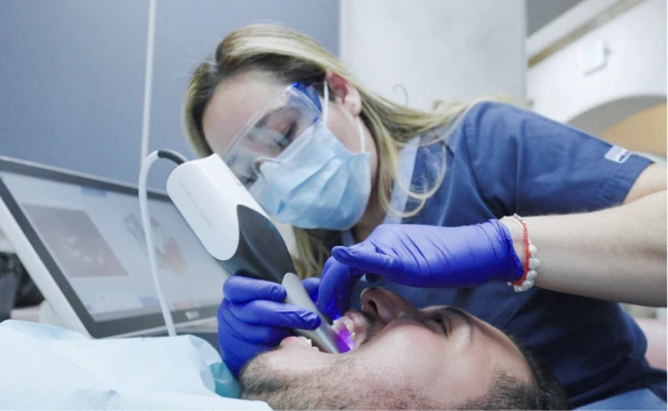 Professional dentist during treatment with patient getting Inlays and Onlays at My Smile Clinic in San Diego.