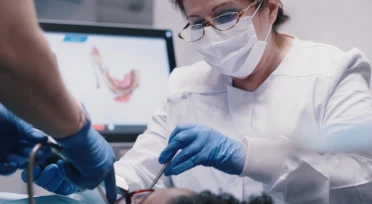 Doctor during cosmetic dentistry treatment in San Diego.