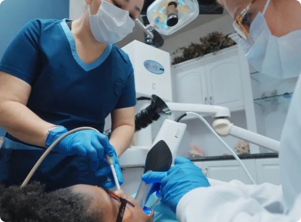 Dental team treating patient during amalgam removal