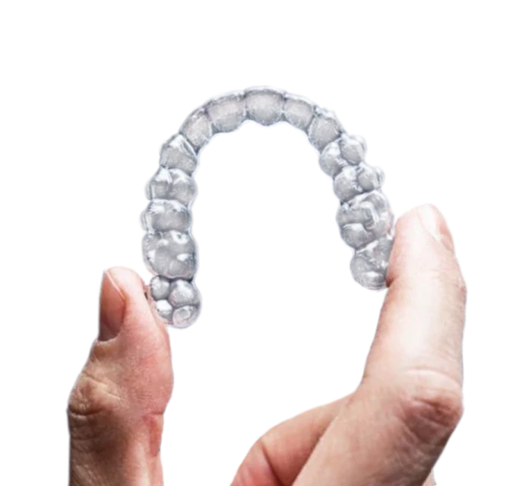 Clear aligner tray held in hand, showing discreet invisible braces for teeth straightening.