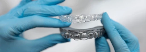 Dentist preparing custom clear aligners for a patient’s orthodontic treatment.