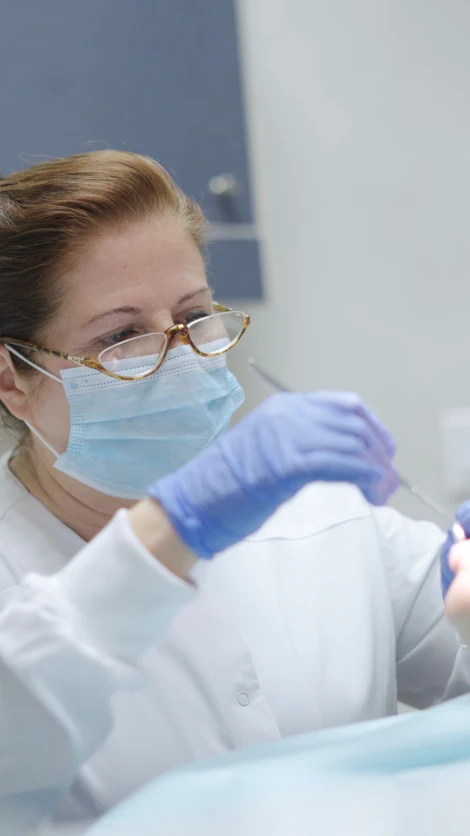 Dentist performing oral examination and consultation for advanced dental care technology available in San Diego.