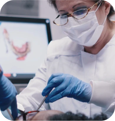 Dr. Irma Gavaldon posing with a patient after completing a dental crown procedure.