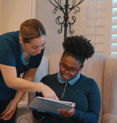Dental staff helping a patient understand insurance benefits and treatment costs.