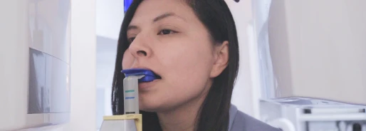 Dentist performing a root canal procedure using advanced dental technology.