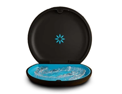 Open Invisalign case containing clear aligners, ready for patient use